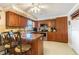 Kitchen with island, stainless steel appliances, and wood cabinets at 5040 Victoria Ln, Holiday, FL 34690