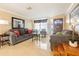Bright living room with two sofas, coffee table, and large mirror at 5040 Victoria Ln, Holiday, FL 34690