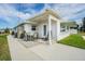 Back patio with table and chairs, great for outdoor dining at 5040 Victoria Ln, Holiday, FL 34690