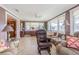 Bright sunroom with large windows and tiled floor at 5040 Victoria Ln, Holiday, FL 34690