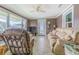 Relaxing sunroom with tiled floor and comfy seating at 5040 Victoria Ln, Holiday, FL 34690