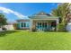 Spacious backyard with covered patio and lush green lawn at 6323 Bayou Grande Ne Blvd, St Petersburg, FL 33702