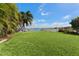 Grass backyard with lush greenery and water views at 6323 Bayou Grande Ne Blvd, St Petersburg, FL 33702