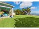 Lush backyard with covered patio and waterfront access at 6323 Bayou Grande Ne Blvd, St Petersburg, FL 33702