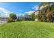 House with backyard, lush grass, and water access at 6323 Bayou Grande Ne Blvd, St Petersburg, FL 33702