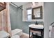 Charming bathroom with a teal glass tile shower and updated vanity at 6323 Bayou Grande Ne Blvd, St Petersburg, FL 33702
