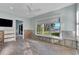 Bedroom with water view and wood flooring at 6323 Bayou Grande Ne Blvd, St Petersburg, FL 33702