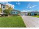 One-story home with light taupe siding and teal accents at 6323 Bayou Grande Ne Blvd, St Petersburg, FL 33702