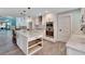 Modern kitchen with white cabinets and large island at 6323 Bayou Grande Ne Blvd, St Petersburg, FL 33702