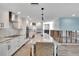 Modern kitchen featuring white cabinets and a large island at 6323 Bayou Grande Ne Blvd, St Petersburg, FL 33702