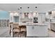 Modern kitchen with white cabinets and a large island at 6323 Bayou Grande Ne Blvd, St Petersburg, FL 33702