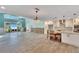 Spacious living area with vaulted ceilings, water views, and hardwood floors at 6323 Bayou Grande Ne Blvd, St Petersburg, FL 33702