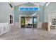 Living area with vaulted ceilings and sliding doors leading to patio and water views at 6323 Bayou Grande Ne Blvd, St Petersburg, FL 33702