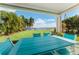 Covered patio overlooking the water with outdoor furniture at 6323 Bayou Grande Ne Blvd, St Petersburg, FL 33702