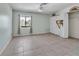 Bright bedroom with tile floors, double closets, and a window at 639 Michigan Blvd, Dunedin, FL 34698