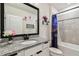 Bathroom with granite countertop, modern vanity, and shower/tub combo at 6684 Devlin Ln, Wesley Chapel, FL 33545