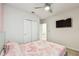 Bedroom with a bed and built-in closet at 6684 Devlin Ln, Wesley Chapel, FL 33545