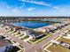 Aerial view of house near lake in a residential area at 682 Olive Conch St, Ruskin, FL 33570
