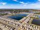 Aerial view of house near lake and waterfront at 682 Olive Conch St, Ruskin, FL 33570