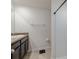 Clean bathroom with a single vanity, shower, and neutral color scheme at 682 Olive Conch St, Ruskin, FL 33570