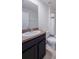 Clean bathroom with dark vanity, toilet and shower/tub combo at 682 Olive Conch St, Ruskin, FL 33570