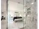 Spa-like bathroom with a glass-enclosed shower and view to bedroom at 855 Bayway Blvd # 804, Clearwater Beach, FL 33767