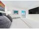 Relaxing bedroom with large TV and ocean view from the balcony at 855 Bayway Blvd # 804, Clearwater Beach, FL 33767