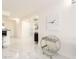 Bright hallway with marble floors, bar cart, and access to kitchen and bar area at 855 Bayway Blvd # 804, Clearwater Beach, FL 33767