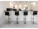 Contemporary kitchen with breakfast bar and sleek barstools at 855 Bayway Blvd # 804, Clearwater Beach, FL 33767