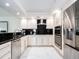Modern kitchen with stainless steel appliances and white cabinets at 855 Bayway Blvd # 804, Clearwater Beach, FL 33767