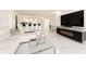 Open concept living area with white sectional, marble floors, and kitchen views at 855 Bayway Blvd # 804, Clearwater Beach, FL 33767