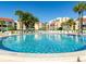 Inviting circular pool surrounded by palm trees and lounge chairs at 855 Bayway Blvd # 804, Clearwater Beach, FL 33767