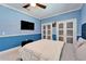 Relaxing bedroom with a comfortable bed and a wall-mounted TV at 9401 93Rd St, Seminole, FL 33777