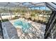 Aerial view of a kidney-shaped pool and patio area at 9401 93Rd St, Seminole, FL 33777