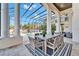 Covered patio with pool, outdoor kitchen, and dining furniture at 9401 93Rd St, Seminole, FL 33777
