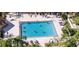Refreshing community pool with surrounding lounge chairs at 1006 Mcdaniel St # 21, Sun City Center, FL 33573