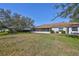 Large backyard with screened patio and grassy area at 1006 Mcdaniel St # 21, Sun City Center, FL 33573