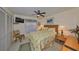 Cozy bedroom with a floral comforter and built-in shelving at 1006 Mcdaniel St # 21, Sun City Center, FL 33573