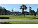 Quaint gazebo nestled in a grassy area with a flagpole at 1006 Mcdaniel St # 21, Sun City Center, FL 33573