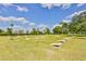 Several cornhole game stations set up on a grassy area at 1006 Mcdaniel St # 21, Sun City Center, FL 33573