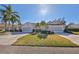 Two-story home with attached garage and manicured lawn at 1006 Mcdaniel St # 21, Sun City Center, FL 33573