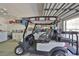 Garage with golf cart, storage cabinets, and laundry area at 1006 Mcdaniel St # 21, Sun City Center, FL 33573