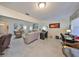 Bright home office with desk and view of living room and backyard at 1006 Mcdaniel St # 21, Sun City Center, FL 33573