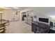 Home office with built-in desk and view into living area at 1006 Mcdaniel St # 21, Sun City Center, FL 33573