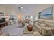 Relaxing living room with large windows and comfortable furnishings at 1006 Mcdaniel St # 21, Sun City Center, FL 33573