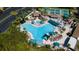 Large community pool with surrounding lounge chairs at 1006 Mcdaniel St # 21, Sun City Center, FL 33573