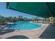 Resort-style pool with shade umbrellas at 1006 Mcdaniel St # 21, Sun City Center, FL 33573
