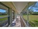 Screened porch with views of the backyard at 1006 Mcdaniel St # 21, Sun City Center, FL 33573