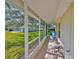 Spacious screened porch with seating and backyard view at 1006 Mcdaniel St # 21, Sun City Center, FL 33573