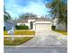One-story house with attached garage and well-manicured lawn at 10232 Grant Creek Dr, Tampa, FL 33647